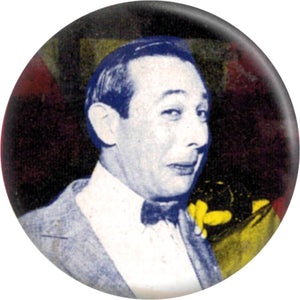 1 1/4” round pinback Pee-Wee Herman in a multicolored blue, yellow, and red collage button 