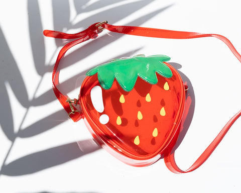 red transparent vinyl strawberry-shaped purse with matching cross-body strap