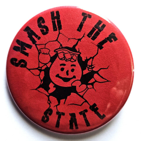 1.25" round pinback button with red background and image of the Kool-Aid Man smashing through a wall with message "SMASH THE STATE"