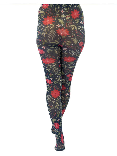 A model wearing opaque tights with a poinsettia, holly, and snowberry pattern on a forest green background. Seen from back