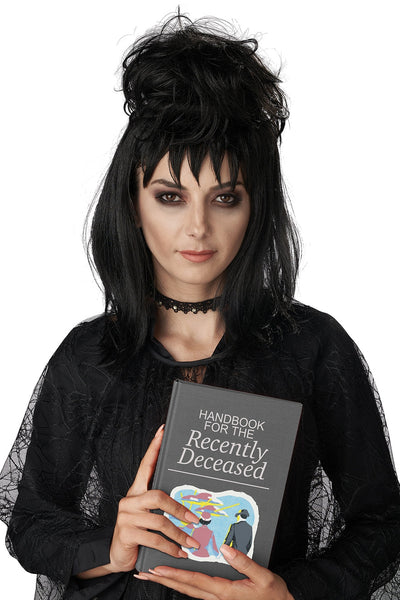 model dressed as Lydia Deetz from Beetlejuice wearing black shoulder length layered wig with spiky bangs and voluminous birds nest updo wearing black lace dress. Shown from front