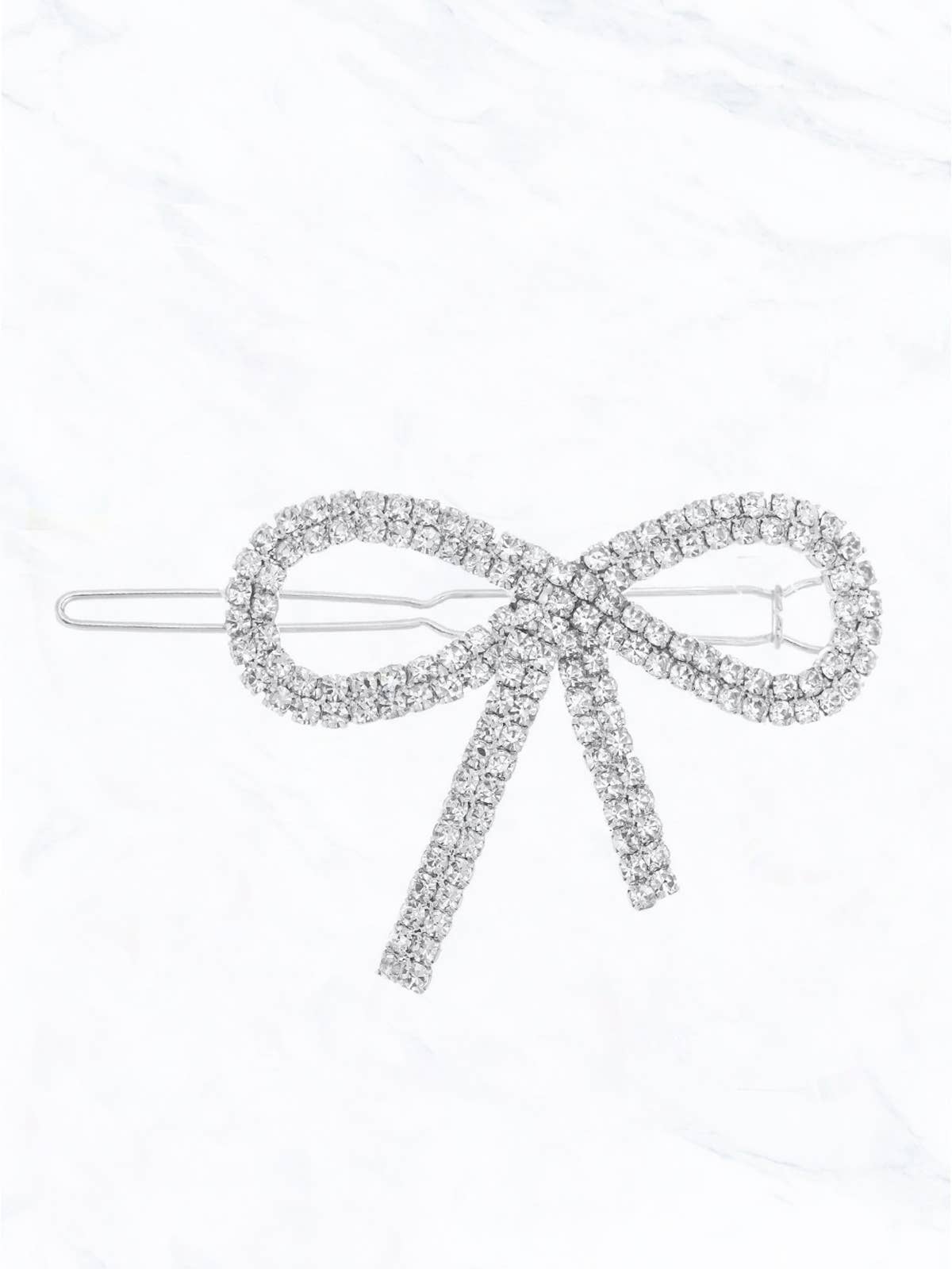 Silver metal barrette in the shape of a bow with clear rhinestone appliqués