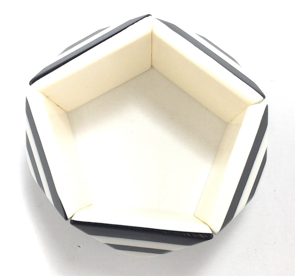 black and white pyramid shaped resin segments with a concentric square pattern stretch bangle. Shown from top