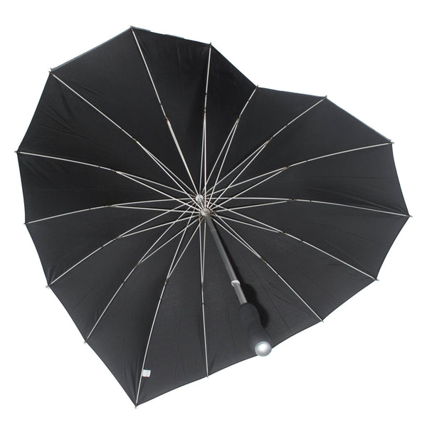 Black heart-shaped umbrella with silver metal handle and black soft foam grip. Shown open from inside 