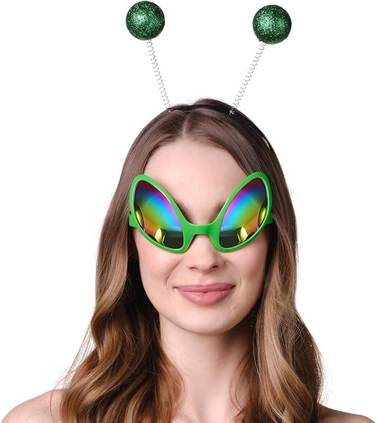 Person wearing colorful sunglasses and a headband with green spherical ends on a white background