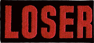 Rectangular black velveteen patch with “LOSER” written in bright red embroidered letters