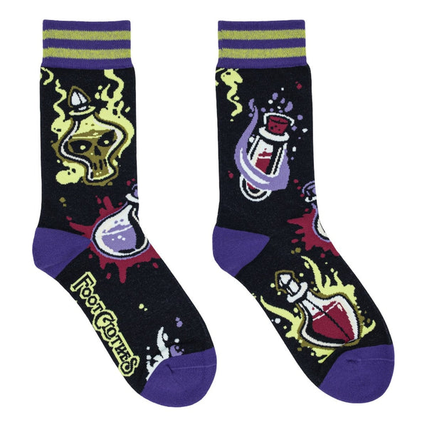 unisex cotton crew socks with all-over pattern of vials and potions surrounded by green and purple smoke with purple toes and heels and green & purple striped cuffs. Shown flat
