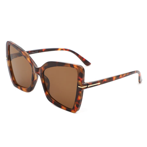 Rectangular tortoiseshell cat eye sunglasses with gold details at the temples and arms with smoke gradient lenses. Shown from the side