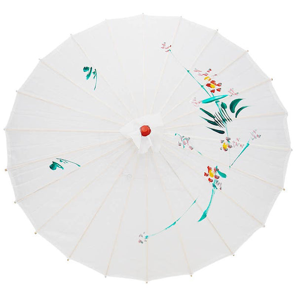 White fabric parasol with hand painted floral designs, red plastic tip, bamboo ribs and handle with red tassel on a white background. Shown open from top 