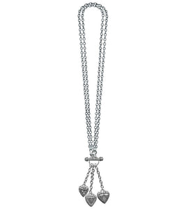 silver metal link chain toggle necklace with trio of heart charms hanging from three smaller chains at front of necklace. Chain shown doubled for shorter necklace