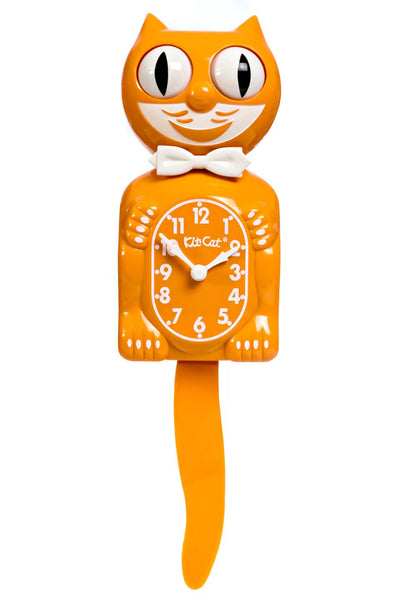 Medium orange colored cat clock with white features and white bow tie. Shown from front