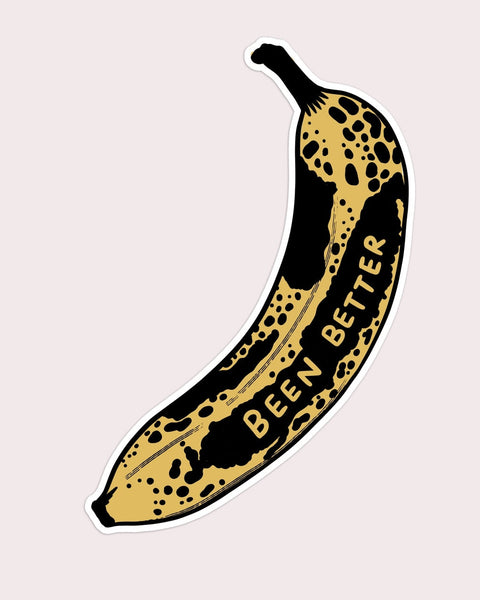 vinyl die cut sticker of a bruised banana with ' BEEN BETTER' text on a light pink background