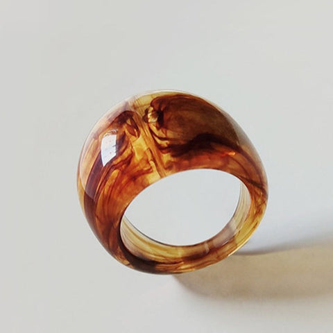 Rounded acrylic ring in a marbled brown pattern