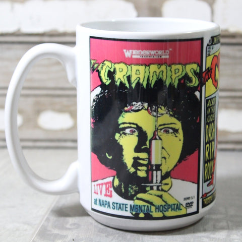 White ceramic mug with neon illustration of Cramps show posters- pictured is “Live at Napa State Mental Hospital”