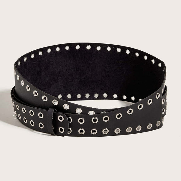 asymmetrical faux black leather waist belt with two pieces- a wide piece of black faux leather with a border of silver metal eyelets and a smaller piece wrapped around it with a double row of eyelets and double pronged buckle. Shown open