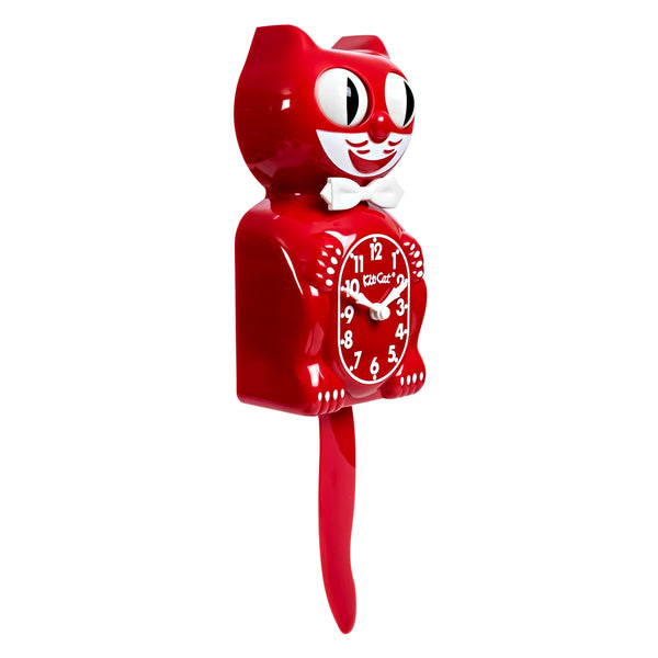 Red colored cat clock with white features and white bow tie. Shown from side at 3/4 angle