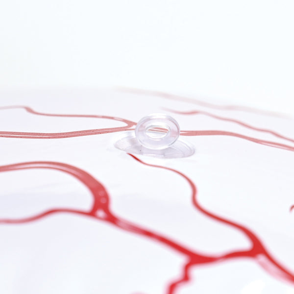 An inflatable novelty ball designed to look like a human eyeball, featuring a white base with red vein-like markings, a yellow and red iris, and a black pupil in the center. Shown in close up of attached hanging tab