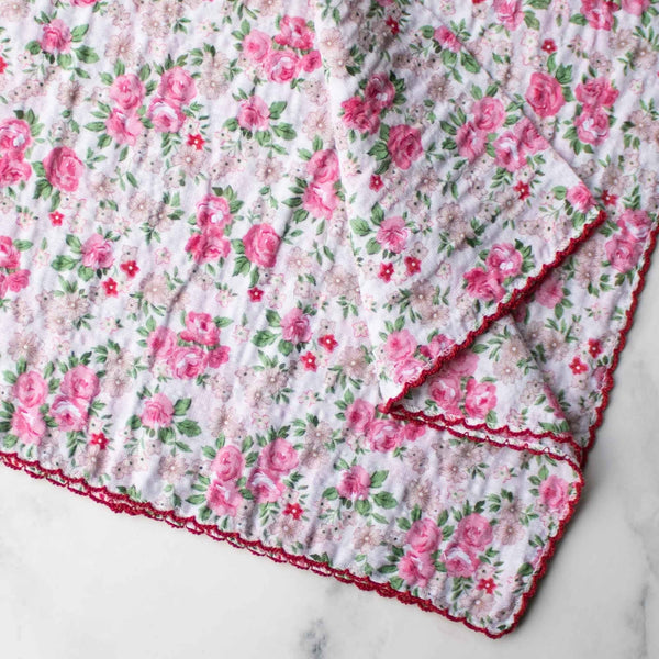 seersucker creamy white cotton scarf with pink rose motif and red embroidered scalloped edge. Shown in close up