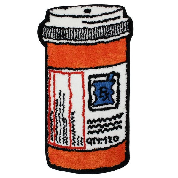 A tufted rug shaped like an orange prescription pill bottle with a white label, black border, and blue Rx symbol, shown from the front on a plain white background.