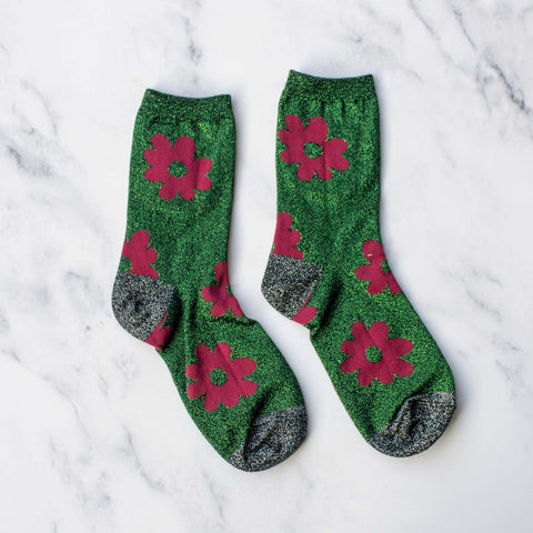 green lurex socks with red knit-in flower pattern and black & silver lurex toes and heels