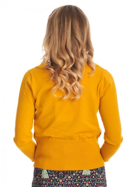 3/4 sleeve mustard yellow pullover sweater features a slightly bloused silhouette with nipped in ribbed waistband, and a scallop edge collar. Shown back view on a model.