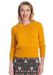 3/4 sleeve mustard yellow pullover sweater features a slightly bloused silhouette with nipped in ribbed waistband, and a scallop edge collar. Shown on a model.