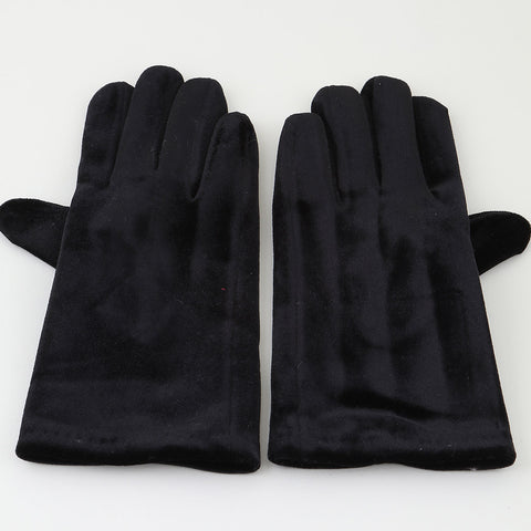 Pair of black velvet wrist length gloves on a white background
