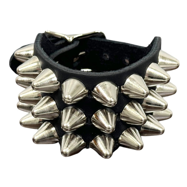 3 row English cone studded black leather cuff with silver metal buckle. Shown closed