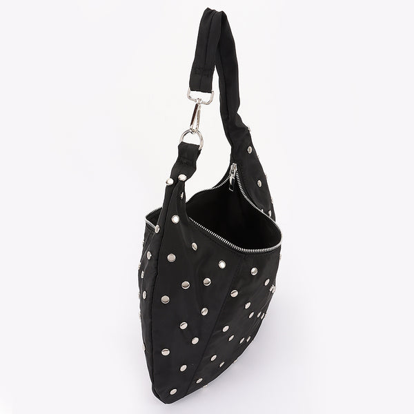 black nylon slouchy shoulder bag with silver flat round stud detail, zip closure, and asymmetrical metal clasp detail at shoulder strap. Shown from side unzipped