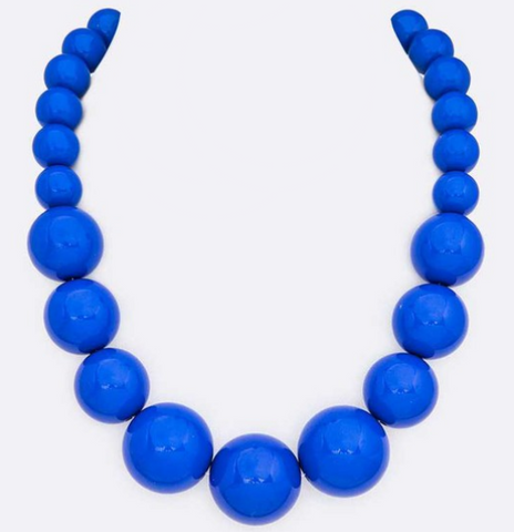 18” long strand of graduating size shiny royal blue round resin beads