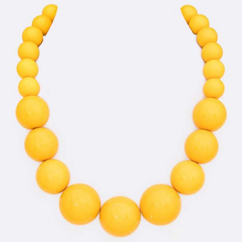 18” long strand of graduating size shiny yellow round resin beads