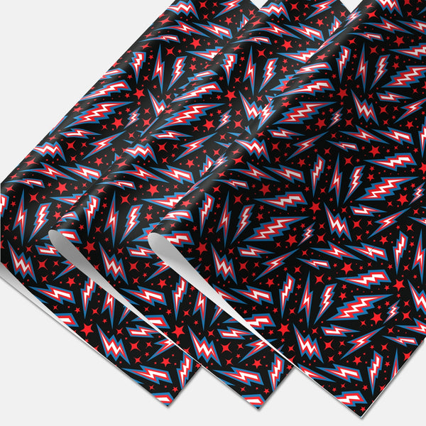 3 sheets of matte finish gift wrap in an all-over red, blue & white lightning bolt and red star pattern on a black background.