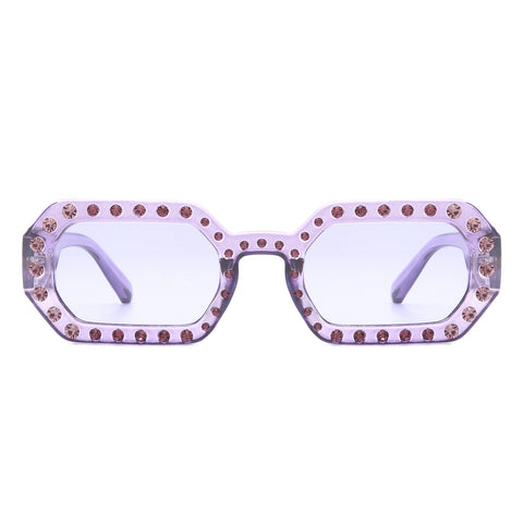 octagon shaped purple translucent frame sunglasses with pink rhinestones of alternating sizes along the frame and arms. Shown from the front