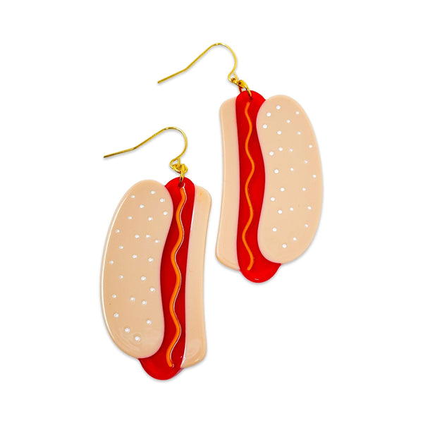 cellulose acetate dangle earrings in the shape of a pair of hot dogs in buns with yellow wavy mustard detail