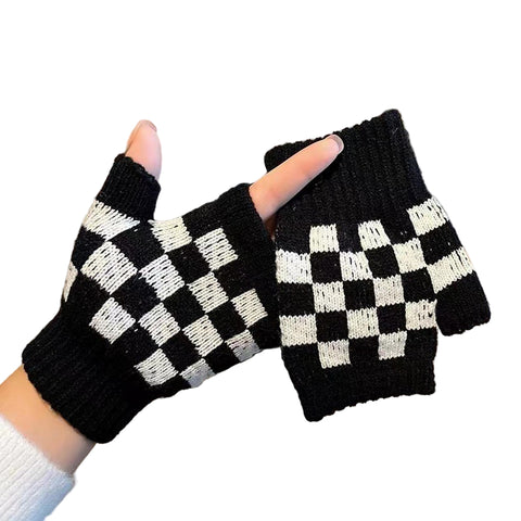 Black and white checkered fingerless gloves held by a person.