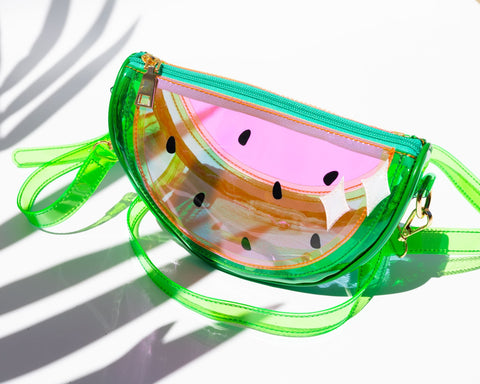 clear pink and green vinyl purse in the shape of a slice of watermelon with matching crossbody strap