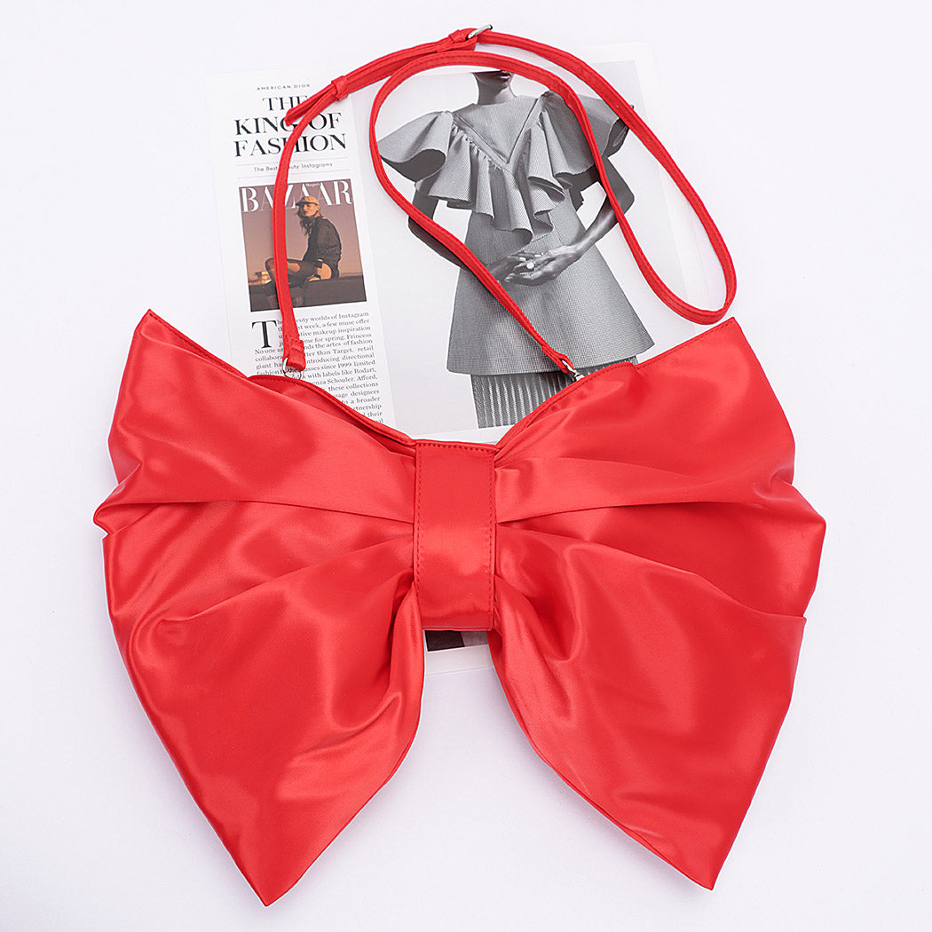 red satin oversized bow-shaped purse with matching crossbody strap