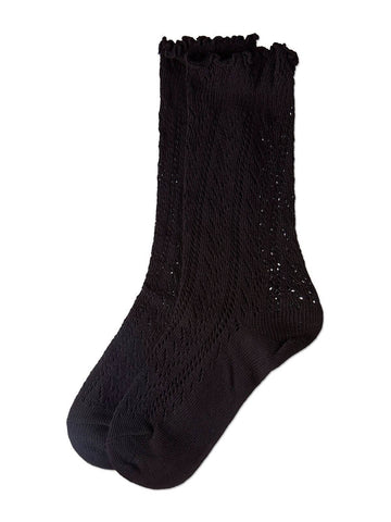 Black socks with textured knit pointelle pattern and ruffled cuff on a white background