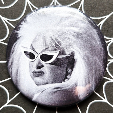 2.25” pinback button of a black and white portrait of Divine