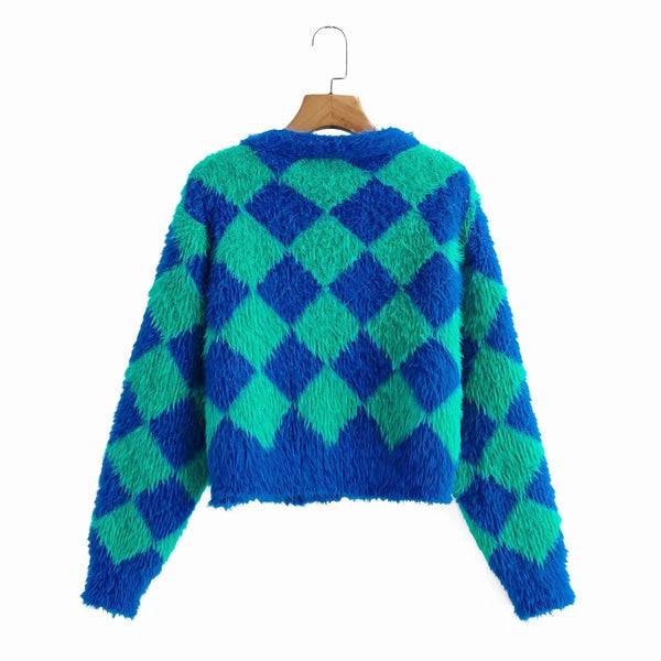 Cropped faux mohair cardigan with dropped shoulders in a bright green and blue harlequin diamond pattern. Shown hanging from the back