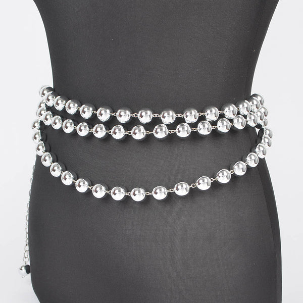 metal belt made of three rows of silver metal ball chains with link chain extender at hip shown on dress form from side