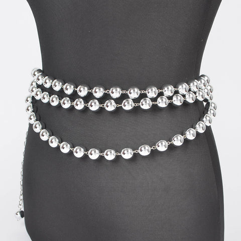 metal belt made of three rows of silver metal ball chains with link chain extender at hip shown on dress form from side