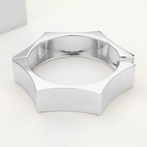 shiny silver metal hexagon shaped hinged bangle. Shown on its side