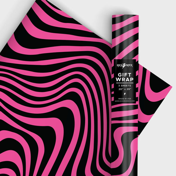 a roll of matte finish gift wrap in an all-over neon fuchsia and black psychedelic swirl pattern. Shown in a roll and flat