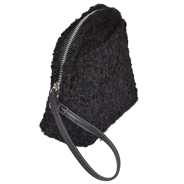 Black textured bouclé faux fur wristlet bag with a curved top and a black faux leather wrist strap, shown from side zipped closed
