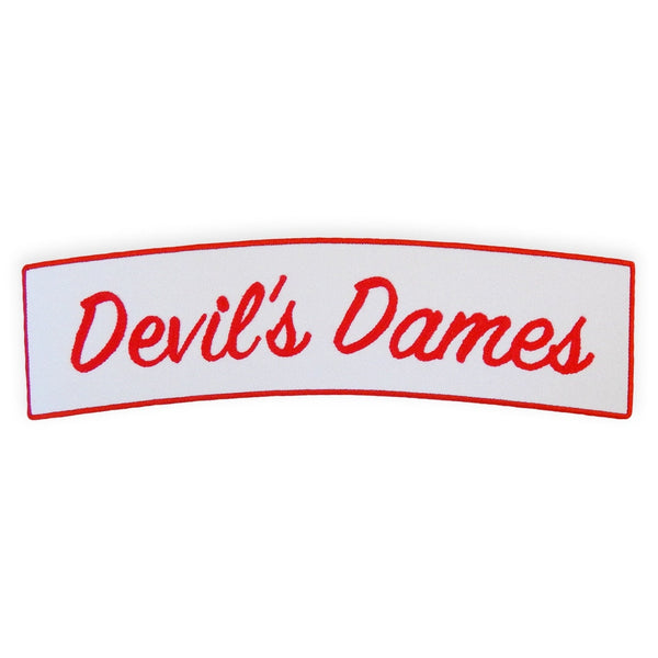 curved rectangular white embroidered back patch with red border and script in red reading "Devil's Dames"