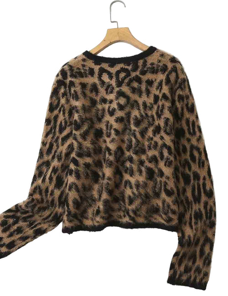 jacquard knit brown and black leopard print cardigan with round neckline and black button front shown from back on a hanger 