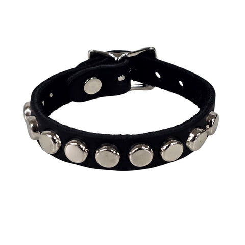 1 row nailhead studded black leather cuff with silver metal buckle. Shown closed