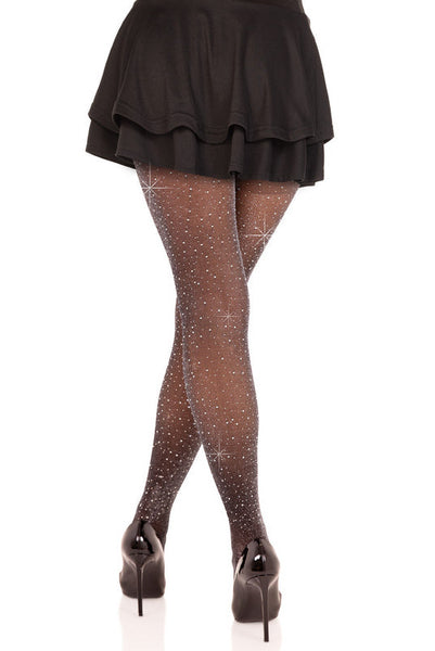 Model wearing black semi-opaque black with silver lurex threads tights with clear rhinestone embellishments. Shown from back