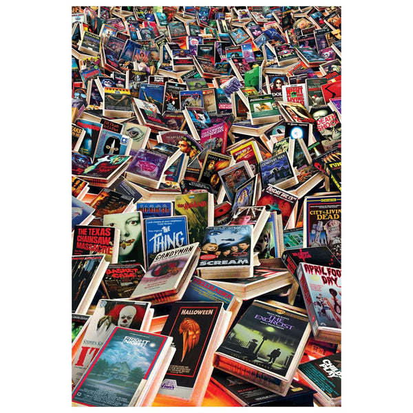 a collage of various retro VHS horror movie tapes in a cluttered pile